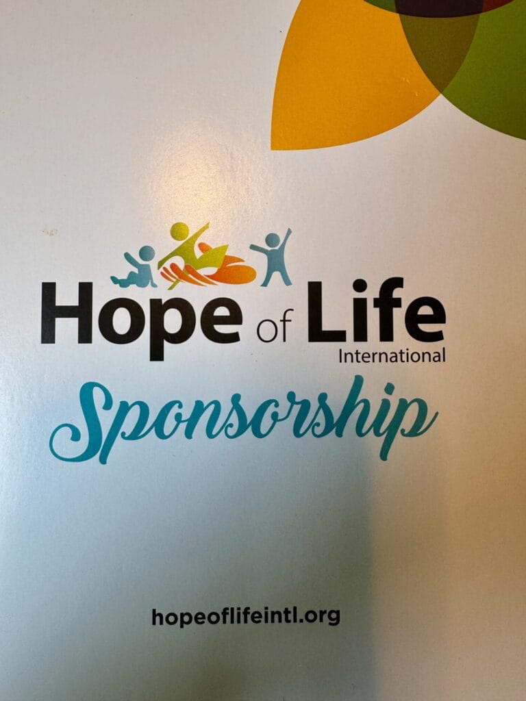 Hope of Life International logo with colorful abstract figures and the word 'Sponsorship'; site hopeoflifeintl.org below.